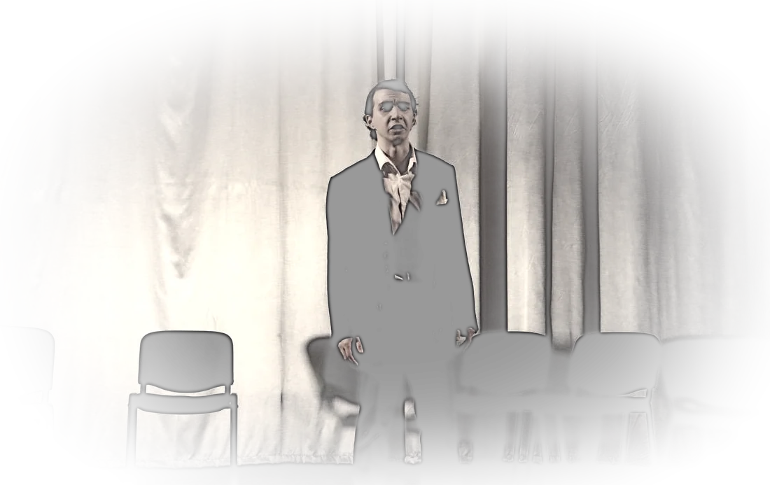 Standing at the front of an empty stage